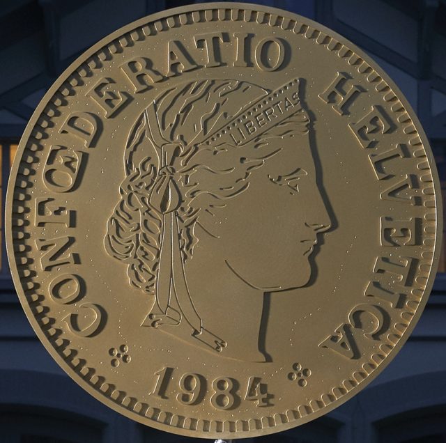 LIBERTAS LIBERTAS – Elena Montesinos - Two large tossing coins installed on Pro Helvetia's headquarters portal in Zurich